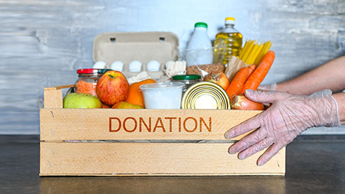 charity donation box full of food and canned goods