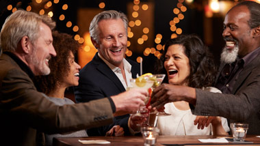group of older friends dining together
