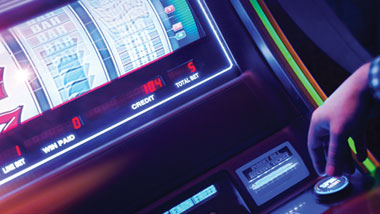 pushing the button on the slot machine